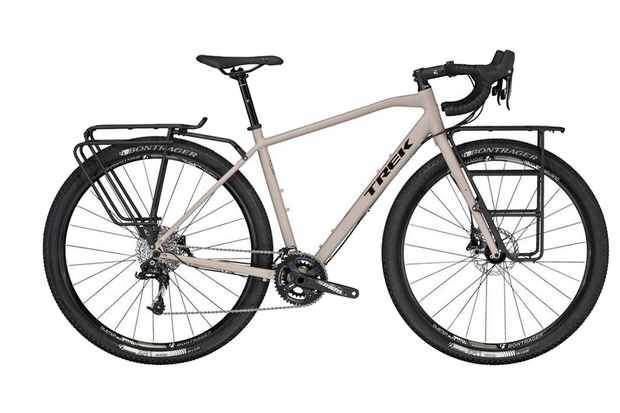 Image of a light grey bicycle with front and rear pannier racks