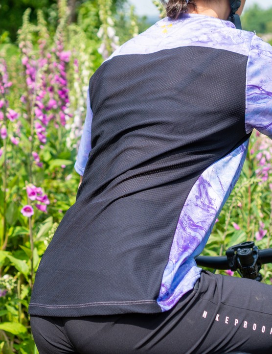 Nukeproof Blackline Women's Short Sleeve Jersey (Earth) mountain bike jersey and Blackline Women's Trail Pants worn by female mountain bike on a Marin Alpine Trail XR enduro mountain bike