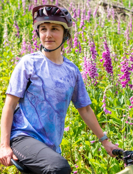 Nukeproof Blackline Women's Short Sleeve Jersey (Earth) mountain bike jersey and Blackline Women's Trail Pants worn by female mountain bike on a Marin Alpine Trail XR enduro mountain bike